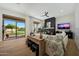 Bright living room with fireplace, hardwood floors, and backyard access at 4417 W El Cortez Trl, Phoenix, AZ 85083