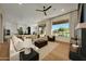Cozy living room featuring hardwood floors, a fireplace, and a large window with a view at 4417 W El Cortez Trl, Phoenix, AZ 85083