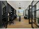 Spacious office with black built-in cabinets, hardwood floors, and modern lighting at 4417 W El Cortez Trl, Phoenix, AZ 85083