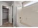 Bathroom with shower-tub combination and a view into the walk-in closet at 45018 W Sage Brush Dr, Maricopa, AZ 85139
