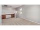 Carpeted bonus room featuring a built-in desk and neutral paint at 45018 W Sage Brush Dr, Maricopa, AZ 85139