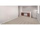 Carpeted bonus room featuring a built-in desk and neutral paint at 45018 W Sage Brush Dr, Maricopa, AZ 85139