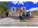 Charming two-story home with a two car garage and beautiful stone accents around the front door at 45018 W Sage Brush Dr, Maricopa, AZ 85139