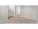 Neutral hallway featuring soft carpet and views leading to other rooms at 45018 W Sage Brush Dr, Maricopa, AZ 85139