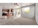 Bright open-concept living area seamlessly connects the living room with the kitchen, featuring lots of natural light at 45018 W Sage Brush Dr, Maricopa, AZ 85139