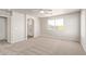Sunlit main bedroom features neutral walls, carpet, and a bright window at 45018 W Sage Brush Dr, Maricopa, AZ 85139