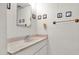 Bathroom features a simple vanity and framed nautical decorations at 4630 N 68Th St # 265, Scottsdale, AZ 85251