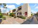 Charming condo exterior with desert landscaping and flowering shrubs at 4630 N 68Th St # 265, Scottsdale, AZ 85251