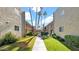 Apartment complex exterior featuring landscaped courtyards and mature palm trees at 4630 N 68Th St # 265, Scottsdale, AZ 85251