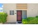 Unit 265 entrance framed by desert landscaping and a decorative security door at 4630 N 68Th St # 265, Scottsdale, AZ 85251