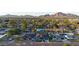 Neighborhood with manicured lawns, mature trees, and a stunning mountain backdrop at 4714 E Lewis Ave, Phoenix, AZ 85008