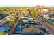 Overhead view of a property with a backyard pool, landscaped yard, and mountain views at 4714 E Lewis Ave, Phoenix, AZ 85008