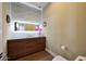 Stylish bathroom features a modern vanity, decorative wall tiles, and sleek fixtures at 4714 E Lewis Ave, Phoenix, AZ 85008