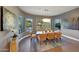 Bright dining room with natural light, backyard views, comfortable seating, and a stylish chandelier at 4714 E Lewis Ave, Phoenix, AZ 85008