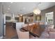 Open-concept dining area features an island, pendant lighting, and seating for eight at 4714 E Lewis Ave, Phoenix, AZ 85008