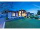 Beautifully landscaped front yard featuring vibrant green grass and modern architectural design at 4714 E Lewis Ave, Phoenix, AZ 85008