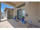 Covered front porch featuring unique planters, decorative orbs, and a modern front door at 4714 E Lewis Ave, Phoenix, AZ 85008