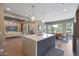 Open-concept kitchen with an island, view to the dining area, and the living room beyond, creating a bright, connected space at 4714 E Lewis Ave, Phoenix, AZ 85008