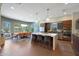 Spacious kitchen and dining area with a large island, stainless steel appliances, and ample natural light at 4714 E Lewis Ave, Phoenix, AZ 85008