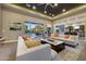Bright living room with neutral tones, large sliding doors, and an open floor plan flowing into the kitchen at 4714 E Lewis Ave, Phoenix, AZ 85008