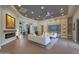 Open-concept living room featuring a modern fireplace, stylish decor, and views of the entryway at 4714 E Lewis Ave, Phoenix, AZ 85008