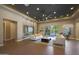 Spacious living room with recessed lighting, contemporary furnishings, and access to the outdoor pool area at 4714 E Lewis Ave, Phoenix, AZ 85008