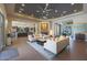 Bright and open living space with stylish seating, a modern fireplace, and views of the kitchen and dining area at 4714 E Lewis Ave, Phoenix, AZ 85008