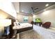 Spacious main bedroom featuring a ceiling fan and a comfortable sitting area at 4714 E Lewis Ave, Phoenix, AZ 85008