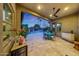 Charming covered patio with outdoor dining area, perfect for enjoying the backyard and pool at dusk at 4714 E Lewis Ave, Phoenix, AZ 85008