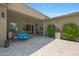 Relaxing covered patio with outdoor dining, offering tranquil views of the lush backyard and greenery at 4714 E Lewis Ave, Phoenix, AZ 85008