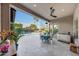 Charming covered patio with outdoor dining area, perfect for enjoying the backyard and pool at 4714 E Lewis Ave, Phoenix, AZ 85008