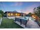 Resort-style backyard with a pool, ample seating, and a serene ambiance at 4714 E Lewis Ave, Phoenix, AZ 85008