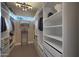 Spacious walk-in closet with custom shelving, drawers, and ample storage for clothing and accessories at 4714 E Lewis Ave, Phoenix, AZ 85008