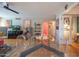 Bright dining space with clear table and chairs in an open-concept living area at 5102 N 31St Pl # 432, Phoenix, AZ 85016