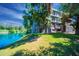 Scenic exterior view of the condo overlooking a lush green lawn and a beautiful pond at 5102 N 31St Pl # 432, Phoenix, AZ 85016