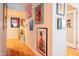 Hallway decorated with curated artwork leading to living area and bedroom at 5102 N 31St Pl # 432, Phoenix, AZ 85016