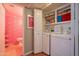 Laundry room with modern appliances and shelving for storage at 5102 N 31St Pl # 432, Phoenix, AZ 85016