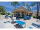 Inviting outdoor patio with tables, chairs, and well-manicured landscaping for relaxing or entertaining at 5102 N 31St Pl # 432, Phoenix, AZ 85016