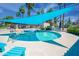 A sparkling pool with a shade sail provides a refreshing oasis for residents to enjoy at 5102 N 31St Pl # 432, Phoenix, AZ 85016