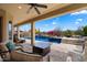 Enjoy the covered patio and views of this custom pool and backyard area with a firepit and BBQ at 5621 E Lonesome Trl, Cave Creek, AZ 85331