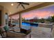 Enjoy the covered patio and views of this custom pool and backyard area with a firepit and BBQ at 5621 E Lonesome Trl, Cave Creek, AZ 85331