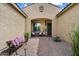 Inviting entryway with seating, desert landscaping, and a brick path leading to the front door at 5621 E Lonesome Trl, Cave Creek, AZ 85331