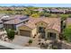 Inviting single-story home with a neutral-toned exterior, tile roof, desert landscaping and an attached two-car garage at 5621 E Lonesome Trl, Cave Creek, AZ 85331