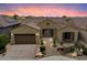Charming home with a desert landscaped front yard and a two-car garage, complete with tiled roof and cozy front patio at 5621 E Lonesome Trl, Cave Creek, AZ 85331