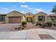Charming single-story home featuring a desert landscaped front yard and a convenient two-car garage at 5621 E Lonesome Trl, Cave Creek, AZ 85331