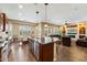 Bright, open kitchen with stainless appliances, island seating, and adjoining living spaces at 5621 E Lonesome Trl, Cave Creek, AZ 85331