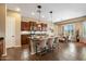 Open kitchen featuring an island with seating and a view into the dining area at 5621 E Lonesome Trl, Cave Creek, AZ 85331