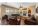 Comfortable living room with leather furniture, fireplace and built-in display shelving at 5621 E Lonesome Trl, Cave Creek, AZ 85331