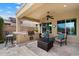 Outdoor kitchen with built-in grill, bar seating, and comfortable seating area, ideal for entertaining at 5621 E Lonesome Trl, Cave Creek, AZ 85331