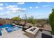 Inviting pool with hot tub and desert landscaping, creating a tranquil outdoor oasis at 5621 E Lonesome Trl, Cave Creek, AZ 85331